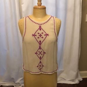 White with pink tribal pattern blouse.